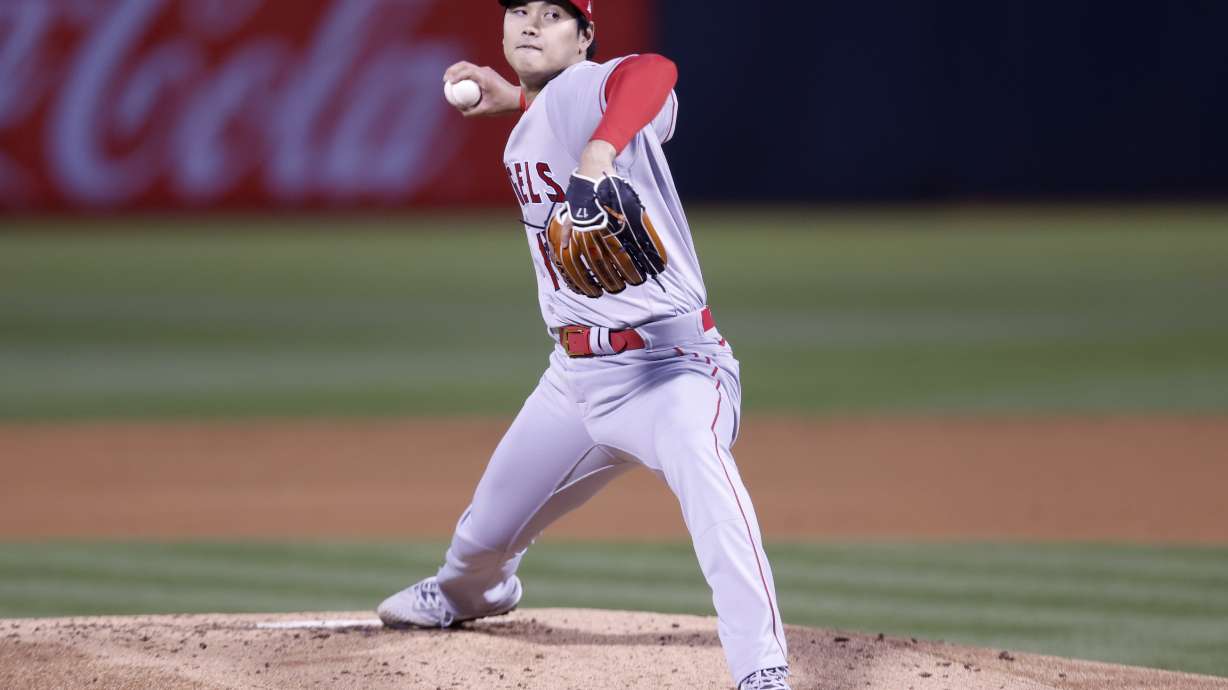 Los Angeles Angels' Shohei Ohtani throws against the Oakland Athletics in the second inning of an opening day baseball game in Oakland, Calif., Thursday, March 30, 2023.