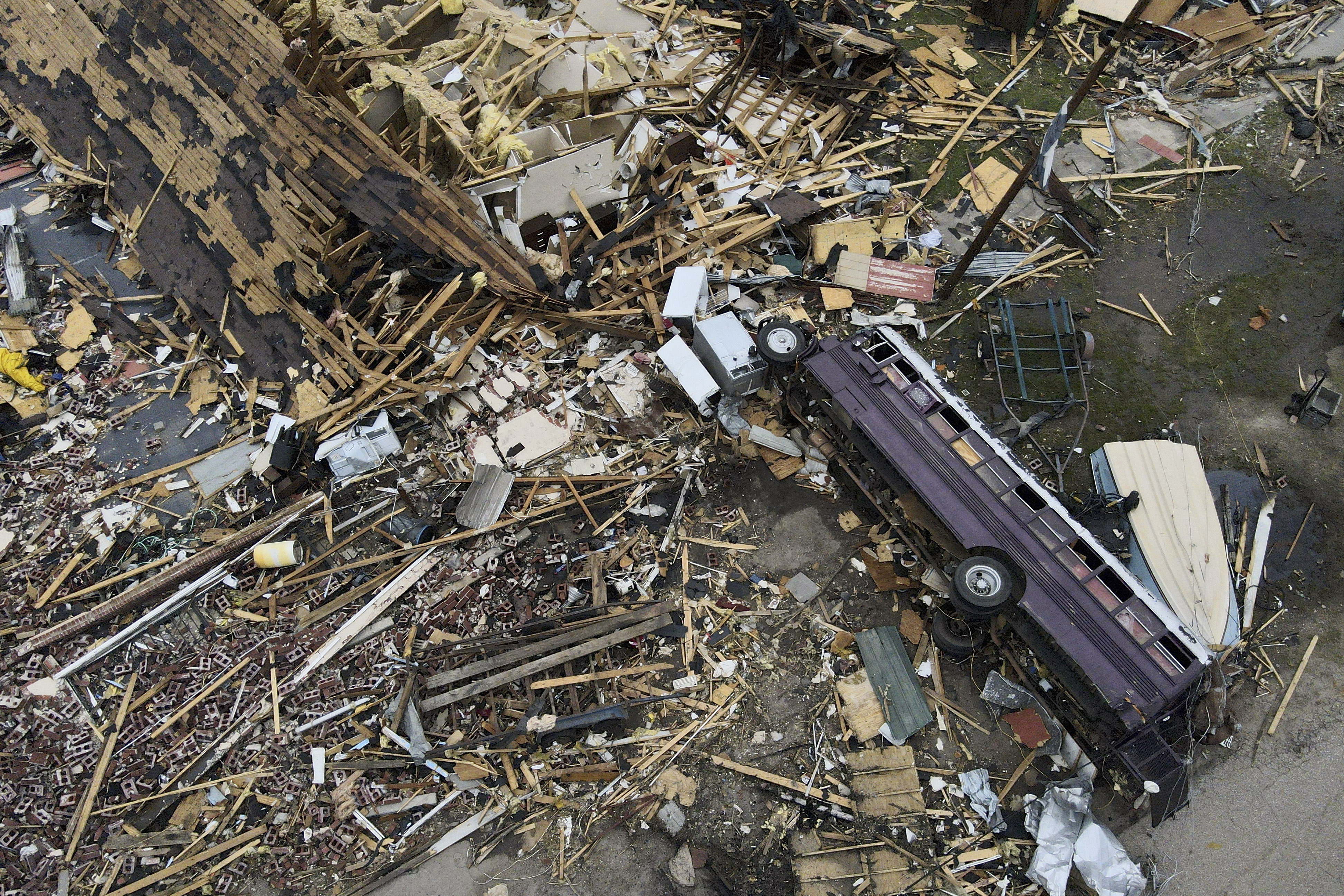 Debris is strewn about tornado-damaged homes March 26 in Rolling Fork, Mississippi. Meteorologists are urging people in parts of the Midwest and southern U.S. to be ready Friday for dangerous weather including tornadoes, saying the conditions are similar to those a week ago that unleashed a devastating twister that killed at least 21 people in Mississippi.