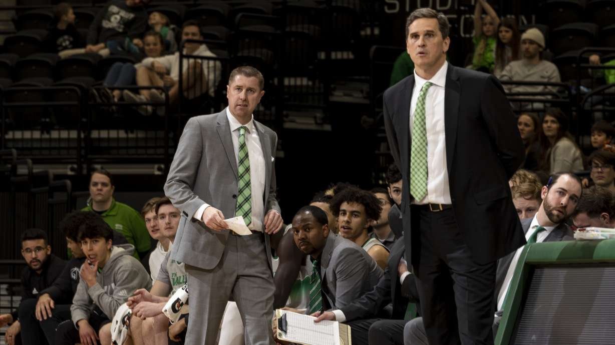 Utah Valley University Wolverines men’s basketball coach Mark Madsen with associate head coach Todd Phillips, left, against the University of Texas Arlington Mavericks, March 1, 2023, in the UCCU Center on the UVU Campus in Orem, Utah.