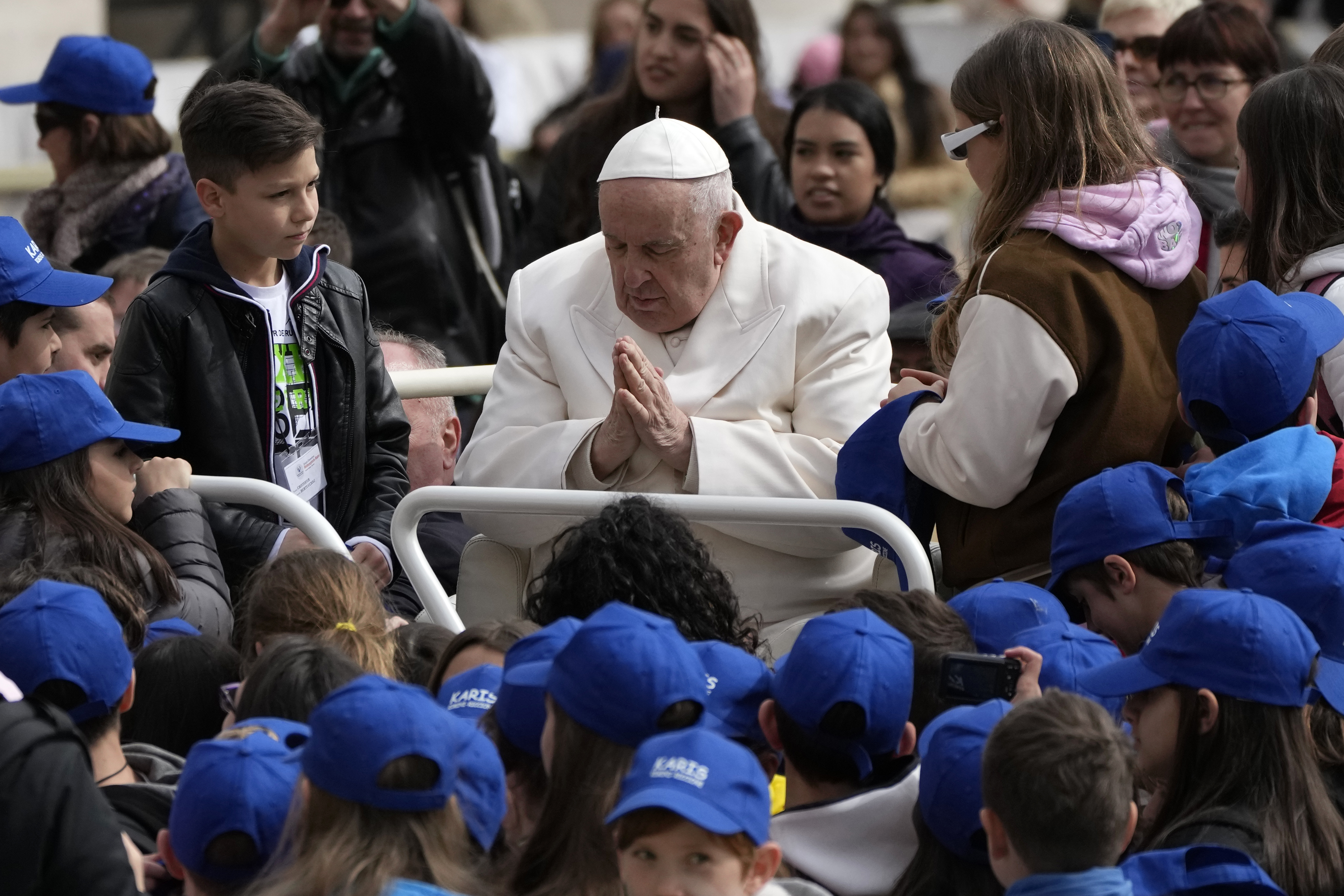 Pope Francis meets children at the end of his weekly general audience in St. Peter's Square, at the Vatican, Wednesday.