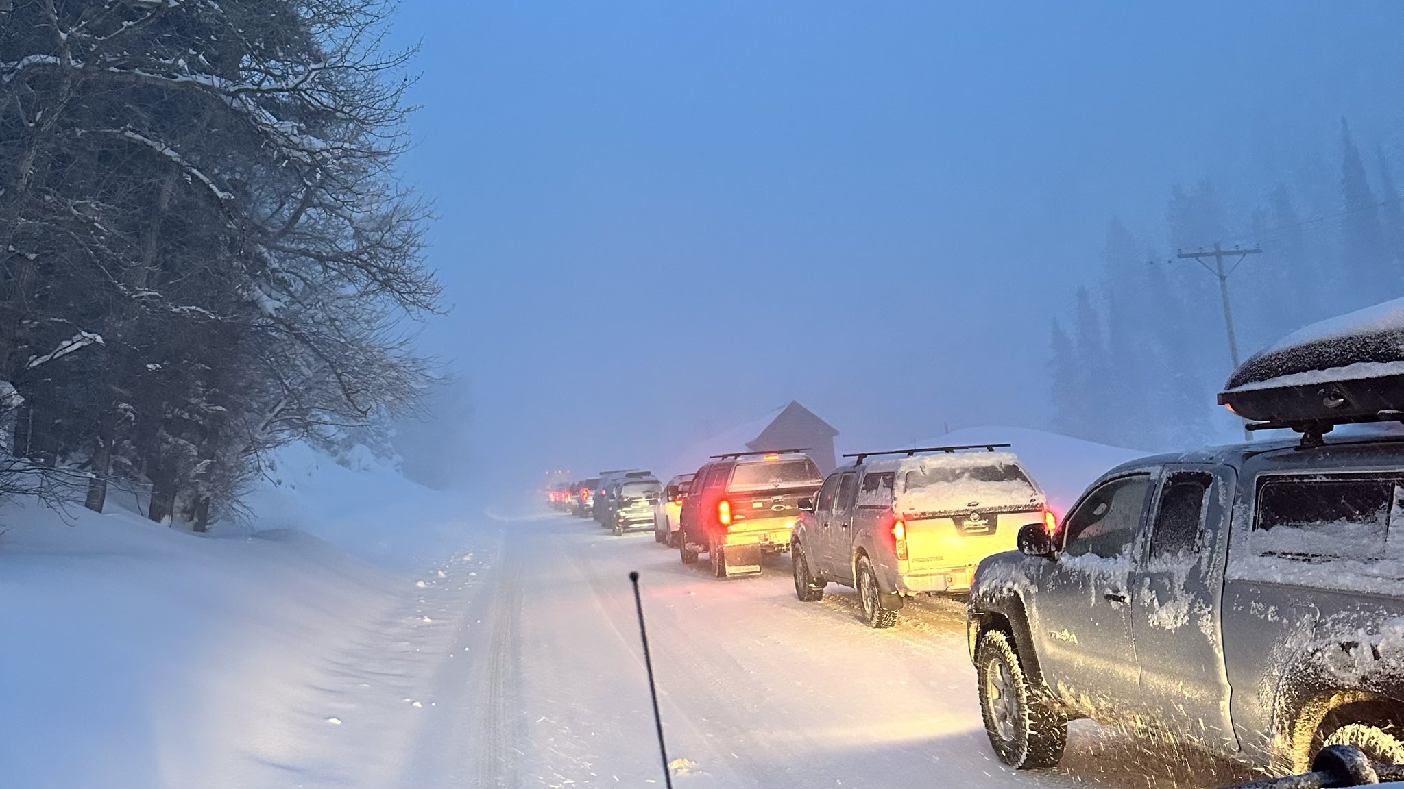 Vehicles line up by Big Cottonwood Canyon on Friday morning. The canyon is closed for avalanche mitigation.