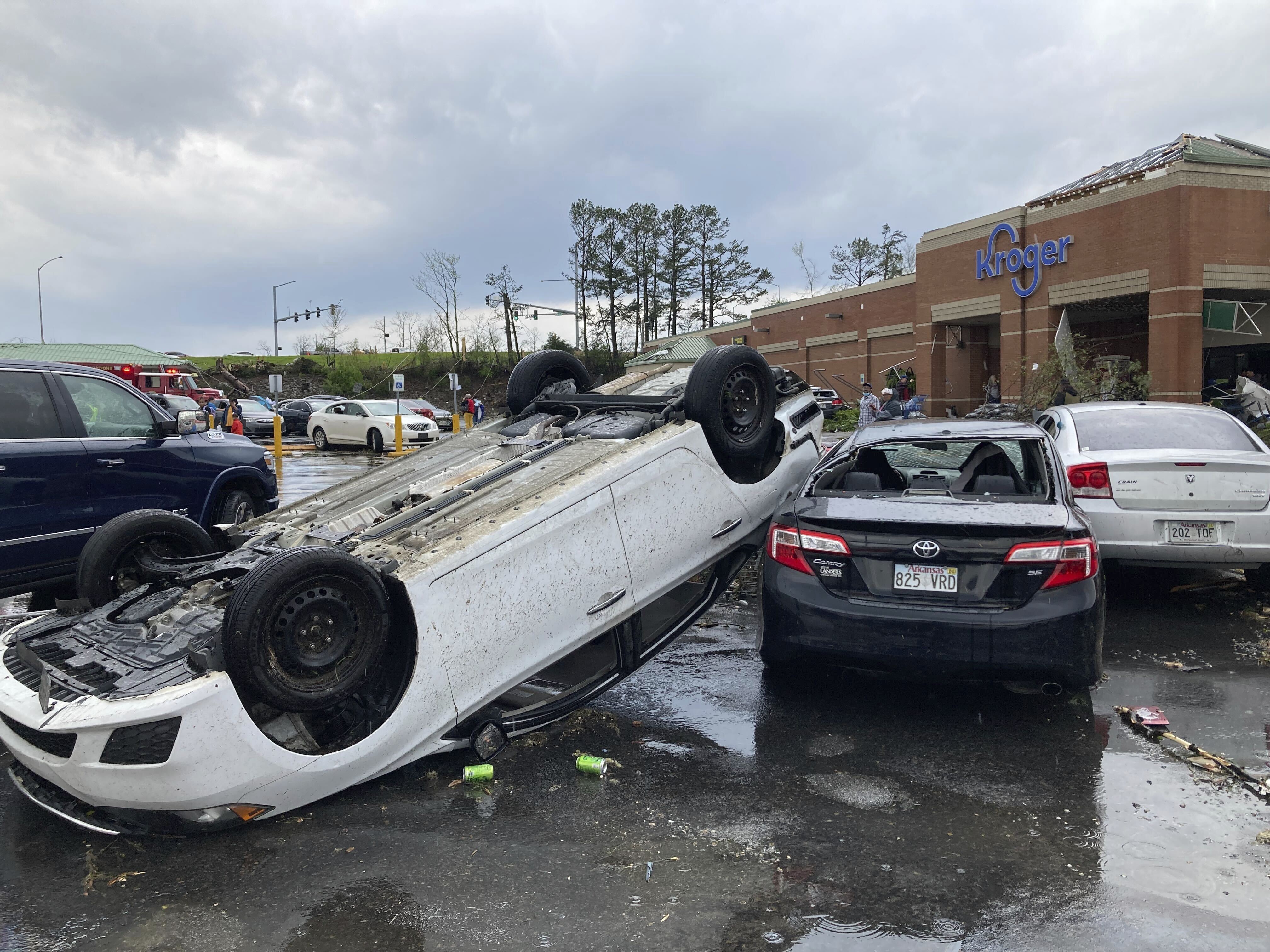 A car is upturned in a Kroger parking lot after severe storm swept through Little Rock, Arkansas, Friday.