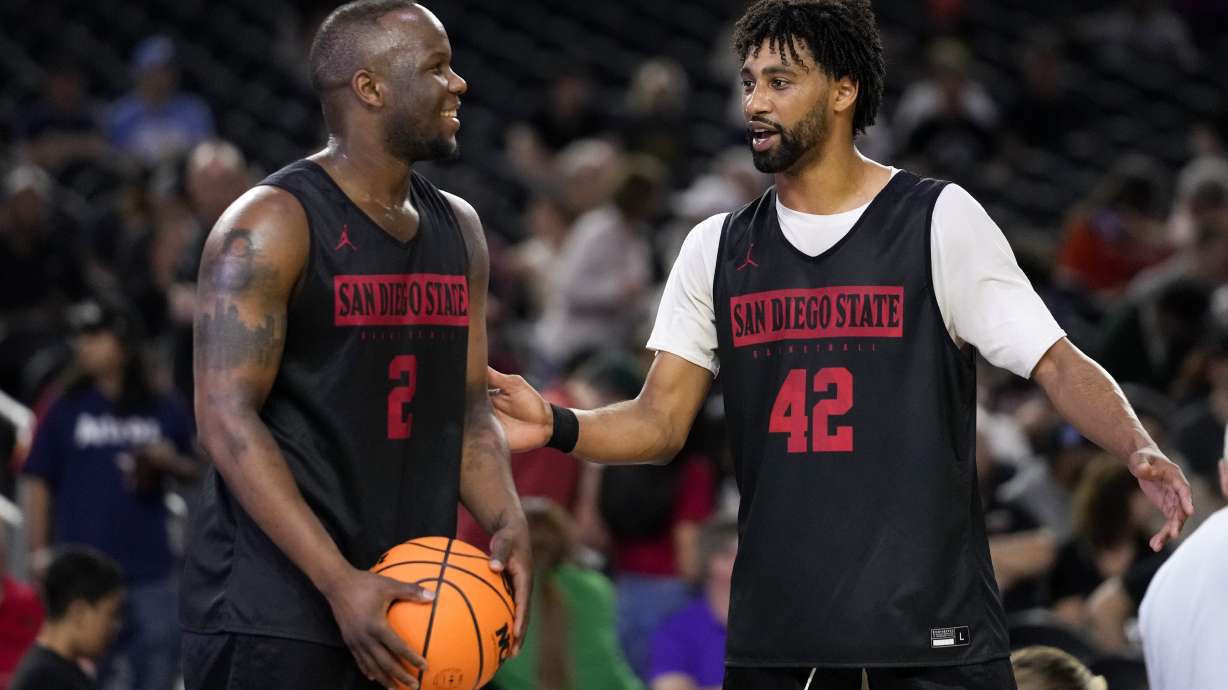 San Diego State guard Adam Seiko, left, and guard Triston Broughton talk during practice for their Final Four college basketball game in the NCAA Tournament on Friday, March 31, 2023, in Houston. San Diego State and Florida Atlantic play on Saturday.