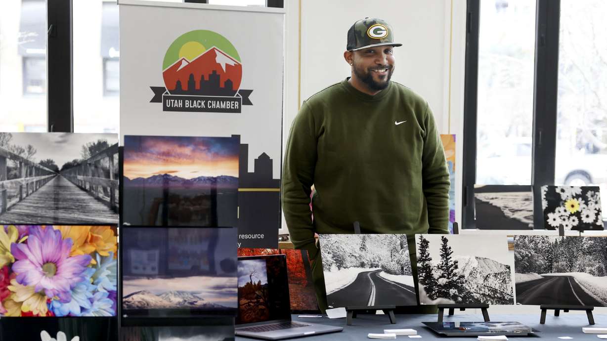Tabarri Hamilton displays his photography at the Utah Black Chamber's "Black and Open for Business" at the Zions Bank Eagle Emporium on Main Street in Salt Lake City on Friday.