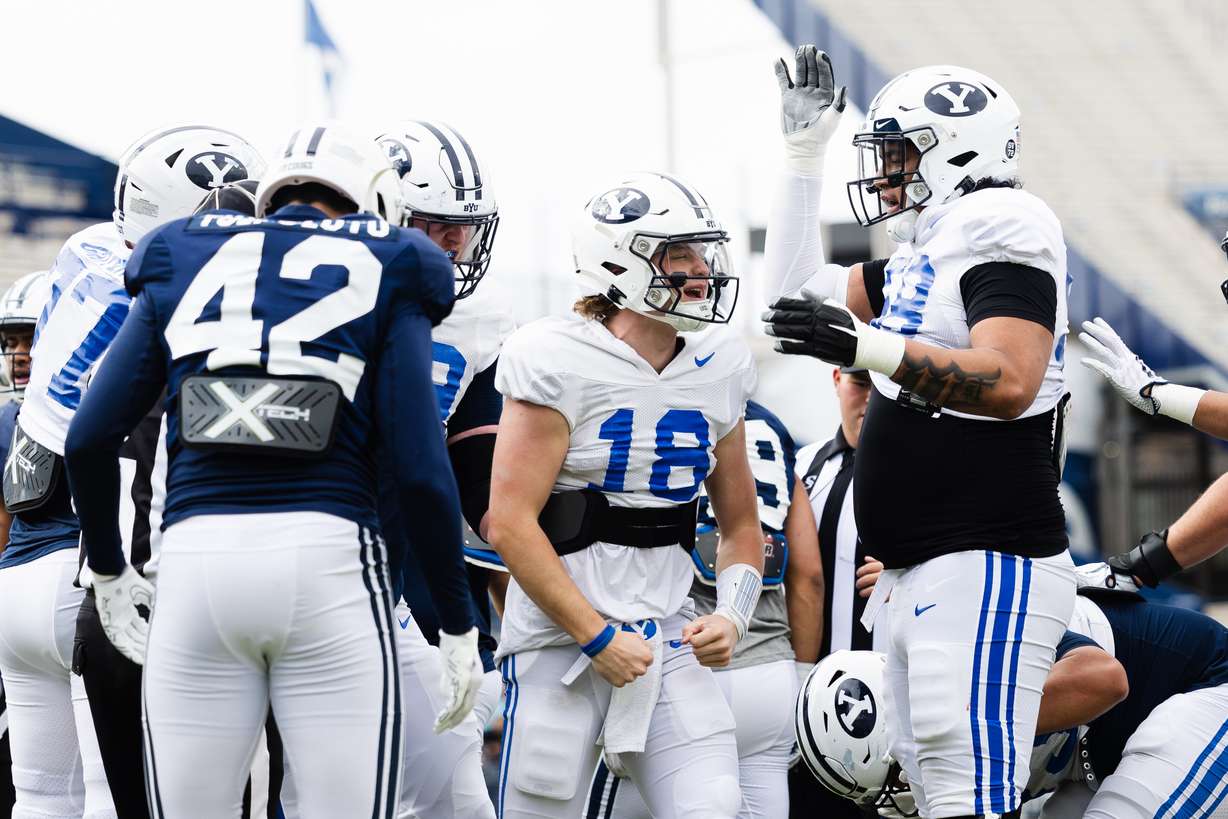 BYU Cougars quarterback Ryder Burton (18) celebrates after a touchdown during the annual BYU Blue vs. White scrimmage at LaVell Edwards Stadium in Provo on Friday, March 31, 2023.