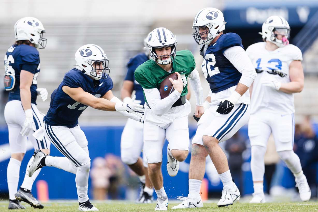 BYU quarterback Kedon Slovis runs the ball during the annual BYU Blue vs. White scrimmage at LaVell Edwards Stadium in Provo on Friday, March 31, 2023.