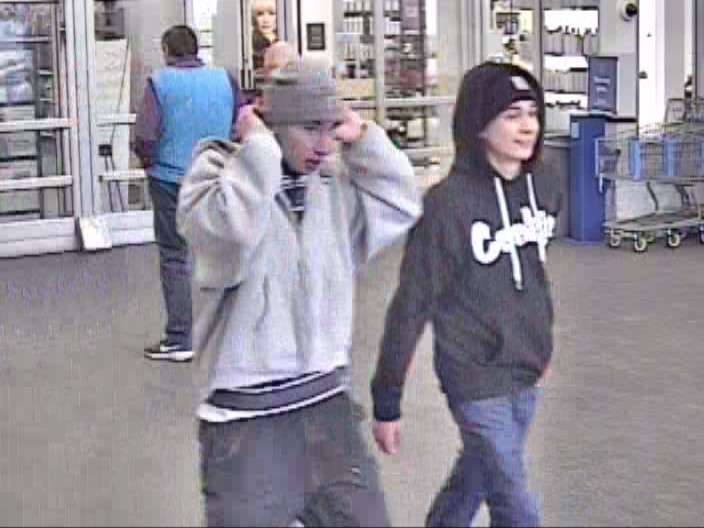 Two young men leave the North Logan Walmart on Friday, March 31, 2023. The store was evacuated after a fake bomb, and police are asking the public to help identify the suspects.