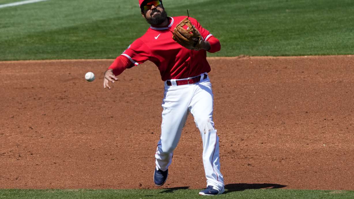 Los Angeles Angels' Anthony Rendon fields a ground out hit by San Diego Padres' Matthew Batten during the third inning of a spring training baseball game, Friday, March 24, 2023, in Tempe, Ariz.