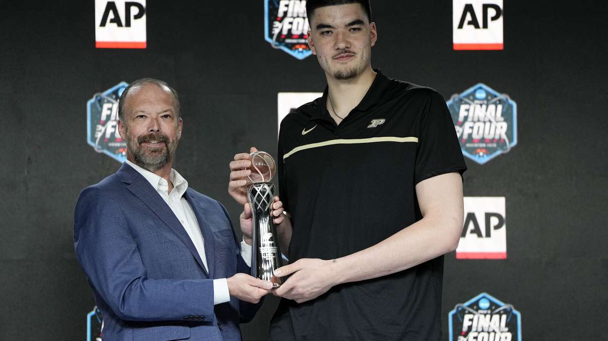 Marquette's Shaka Smart, left, and poses with Purdue's Zach Edey at a press conference after both were introduced as the AP Coach of the Year and AP Player of the Year during the Final Four NCAA college basketball tournament on Saturday, April 1, 2023, in Houston.