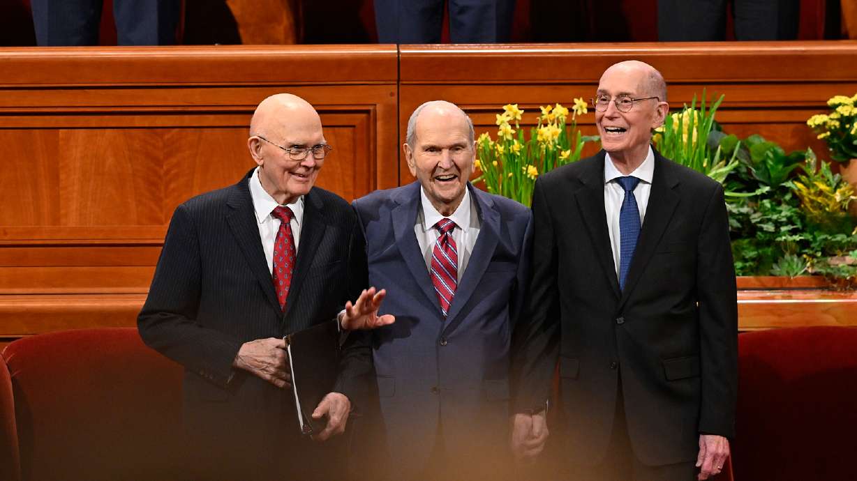 The First Presidency — from left, President Dallin H. Oaks, first counselor, President Russell M. Nelson, and President Henry B. Eyring, second counselor — greet the congregation during the Saturday evening session of the 193rd Annual General Conference of The Church of Jesus Christ of Latter-day Saints at the Conference Center in Salt Lake City.