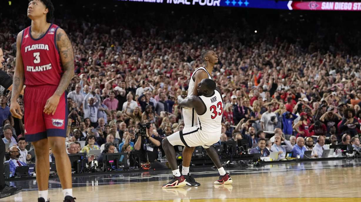 San Diego State guard Lamont Butler celebrates after scoring the game winning basket with forward Aguek Arop (33) during the second half of a Final Four college basketball game against Florida Atlantic in the NCAA Tournament on Saturday, April 1, 2023, in Houston.