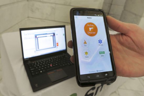 A smartphone is held during a demonstration of the Rave Panic Button application at the Arkansas state Capitol in Little Rock, Arkansas, Aug. 11, 2015. The system is designed to enable authorities to respond to crises faster across more than 1,000 public schools in Arkansas.