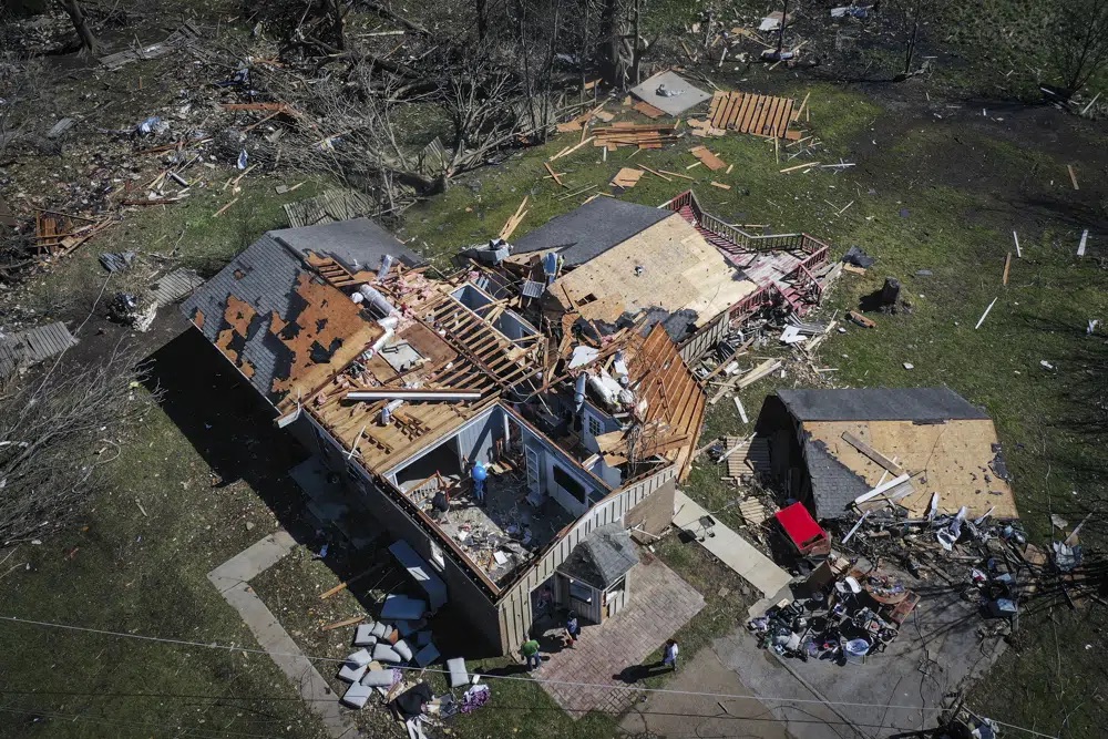 A house that belongs to Patrick Glover is damaged from a tornado in Covington, Tennessee, on Saturday after it was hit by a tornado the night before. Glover, his wife and their newborn child survived the storm by evacuating to his parent's house