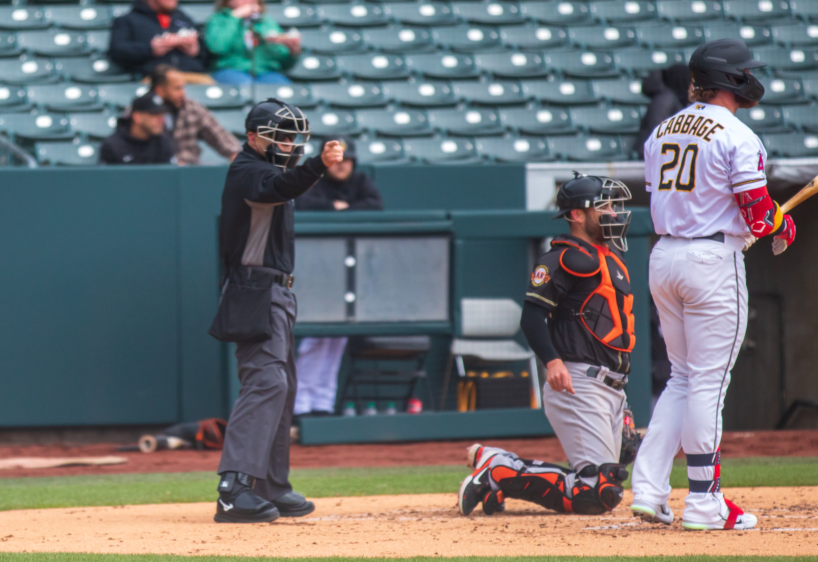 Home plate umpire David Arrieta calls a strike on Salt Lake Bees designated hitter Trey Cabbage during a game at Smith's Ballpark on Saturday, April 1. All 30 Triple-A teams are using some form of the automatic ball-strike system this season.