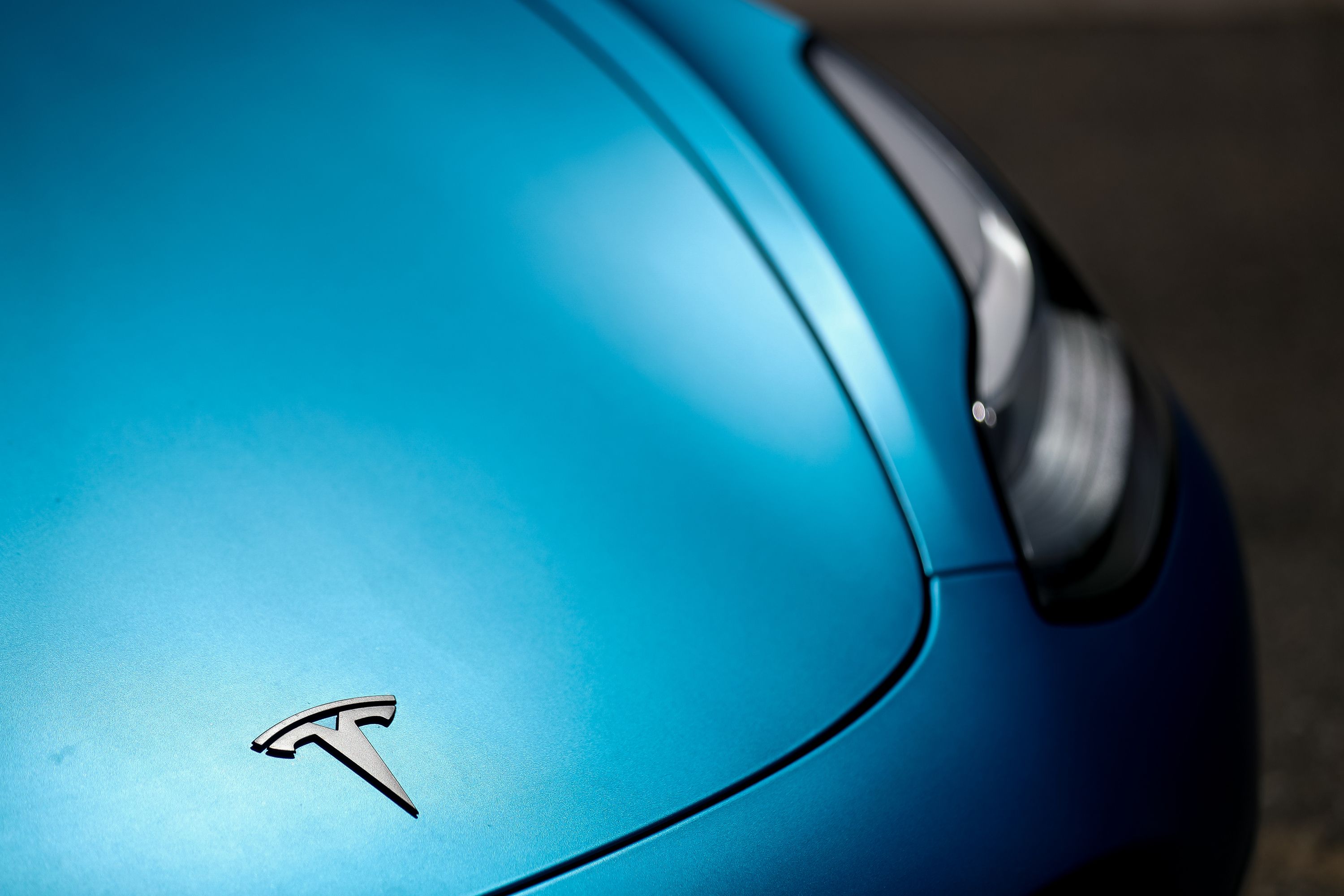 A Tesla Model 3 in Holladay on Saturday, May 16, 2020. Polling shows a majority of voters in Utah support a new law which shaves two cents off the state gas tax but imposes a 12.5% tax on electric vehicle charging stations. 