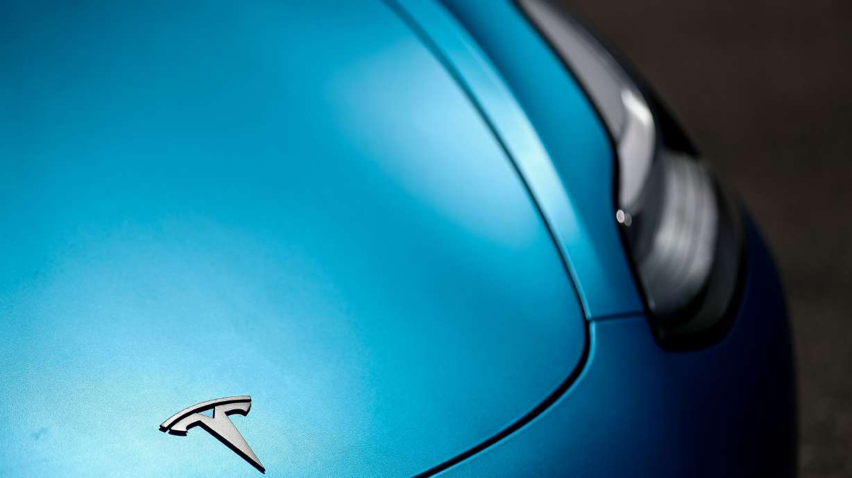 A Tesla Model 3 in Holladay on Saturday, May 16, 2020. Polling shows a majority of voters in Utah support a new law which shaves two cents off the state gas tax but imposes a 12.5% tax on electric vehicle charging stations.