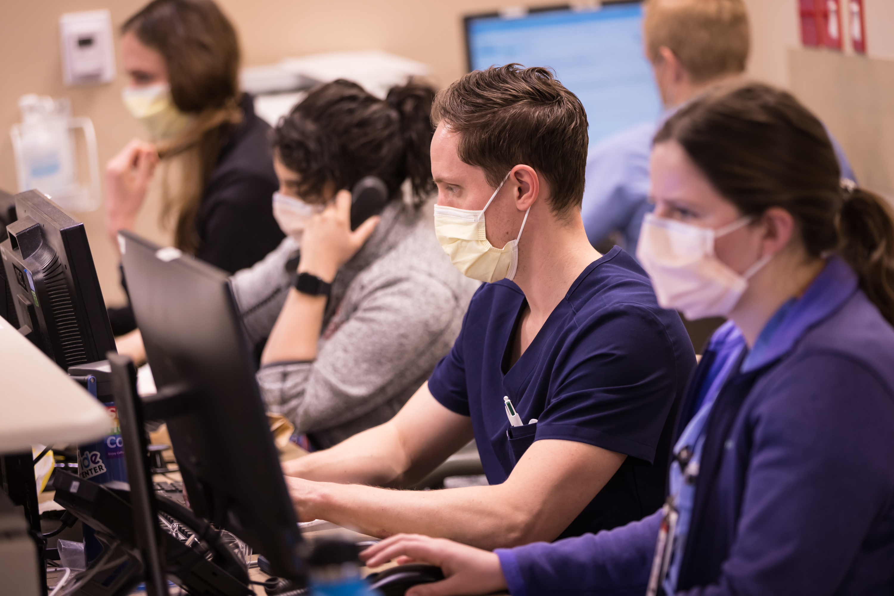 University of Utah Health workers treat COVID-19 patients inside the medical intensive care unit at the U. Hospital in Salt Lake City on March 9, 2022. U. Health announced it will move to optional masking in most clinical locations.