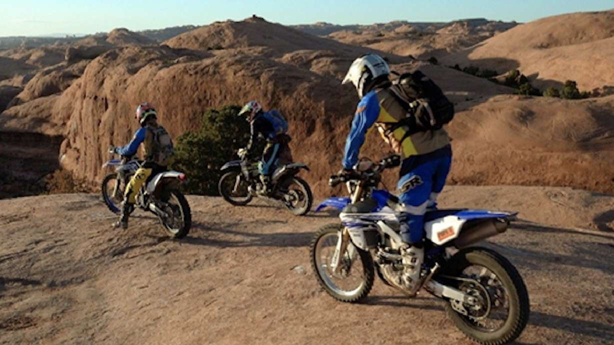 An undated photo of three motorcyclists riding on slickrock at Sand Flats Recreation Area. The Bureau of Land Management is seeking fee increases at the park over the next few years.