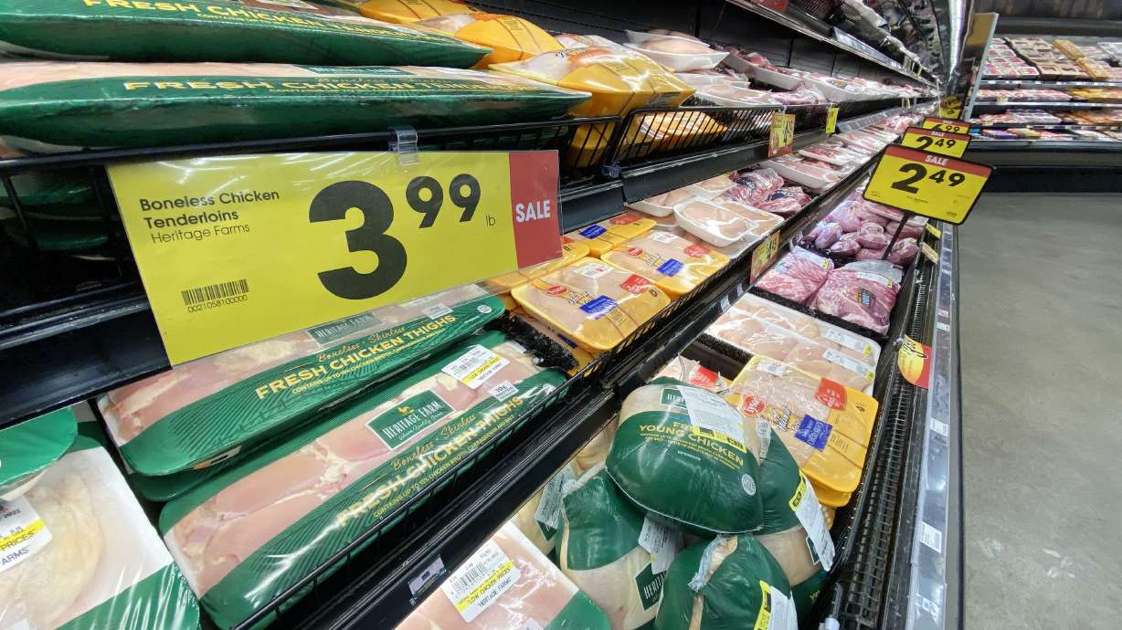 Chicken is pictured on the shelves of a local grocery store in Salt Lake City on April 11, 2022. A new federal report says that food prices rose 11% between August 2021 and August 2022. And predictions are they’ll rise another 8% this year.
