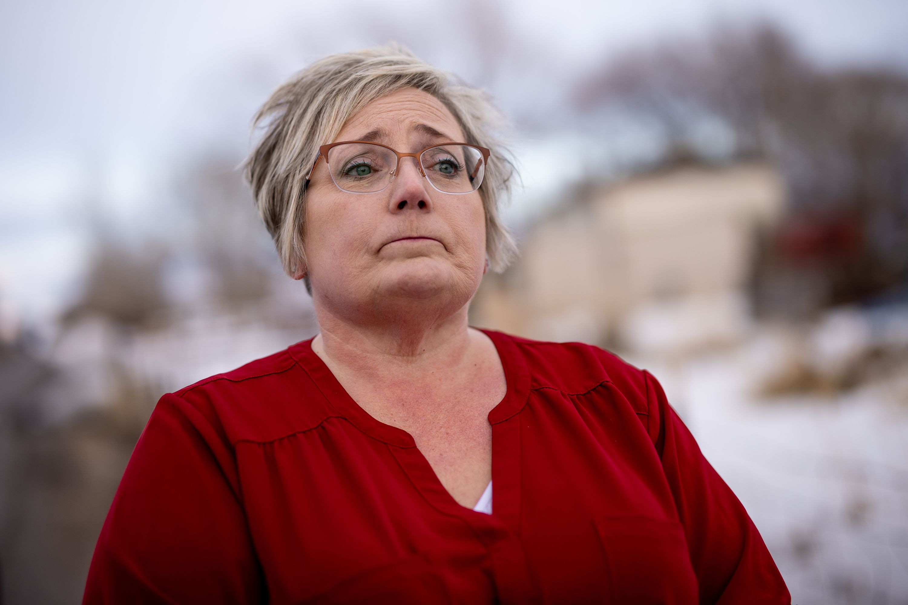 Peggy Jeppesen talks to journalists while standing beside a memorial for Tylee Ryan and JJ Vallow, which she helped set up across the street from Chad Daybell’s property in Salem, Idaho, on March 29.