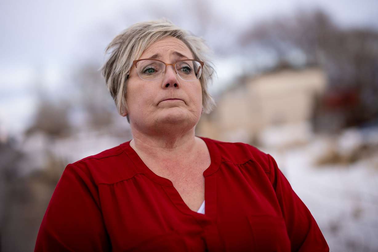 Peggy Jeppesen talks to journalists while standing beside a memorial for Tylee Ryan and JJ Vallow, which she helped set up across the street from Chad Daybell’s property in Salem, Idaho, on March 29.