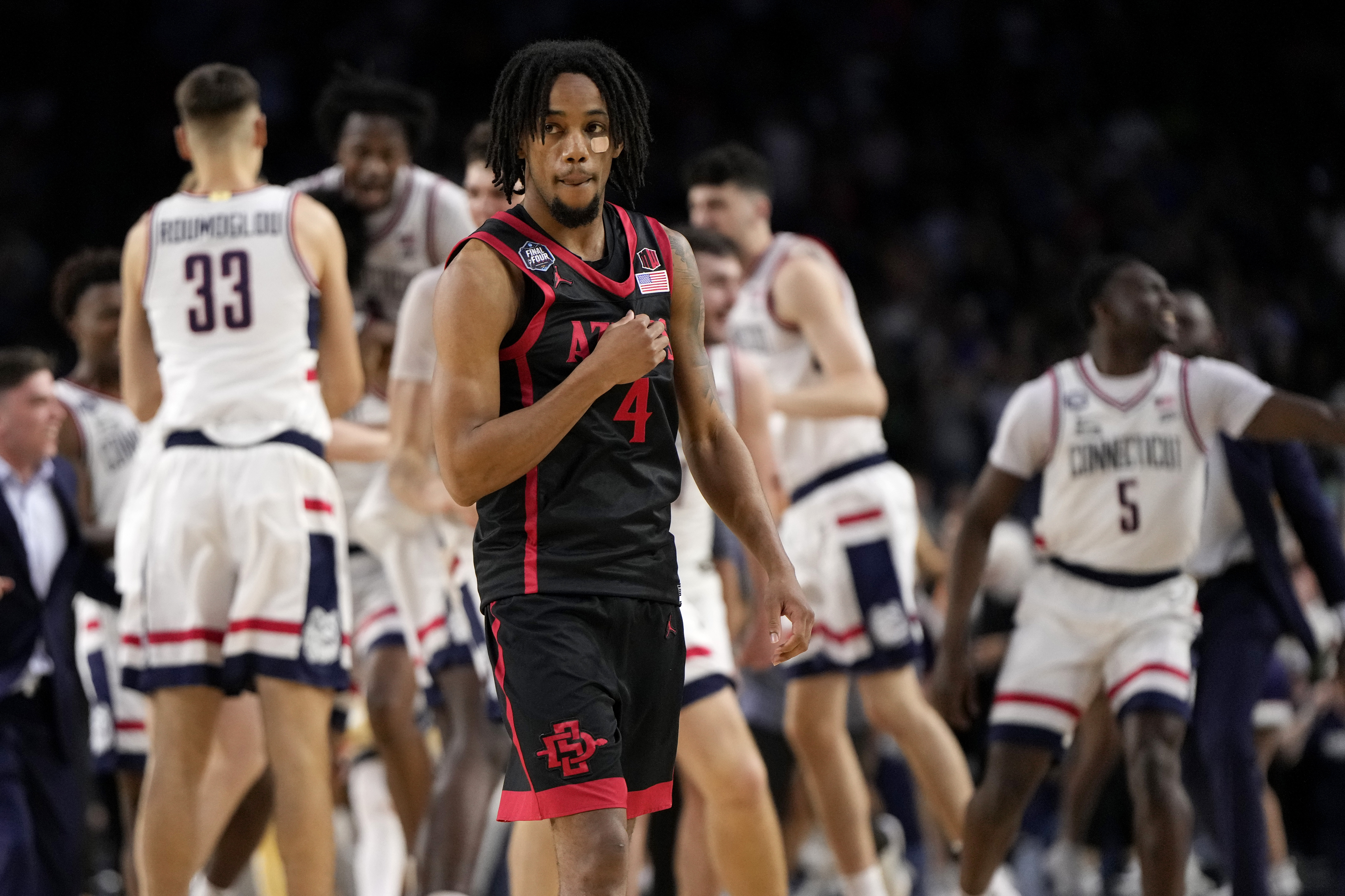San Diego State guard Jared Barnett leaves the floor after their loss against Connecticut during the men's national championship college basketball game in the NCAA Tournament on Monday, April 3, 2023, in Houston.