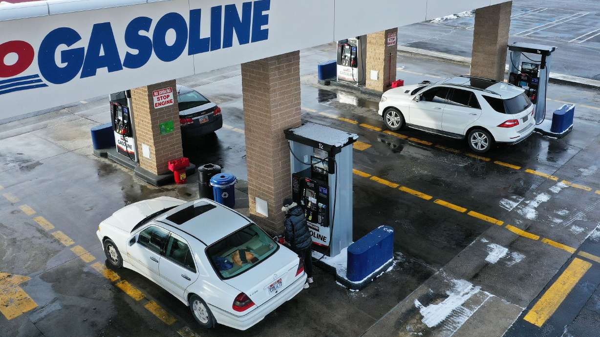 Motorists get gas at Costco in Murray on Feb. 14. A group of OPEC+ countries just slashed oil production rates by 1 million barrels per day.