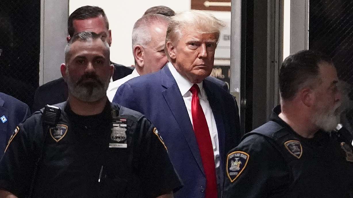 Former President Donald Trump arrives at court, Tuesday, in New York. Trump pleaded not guilty to 34 felony counts of falsifying business records.