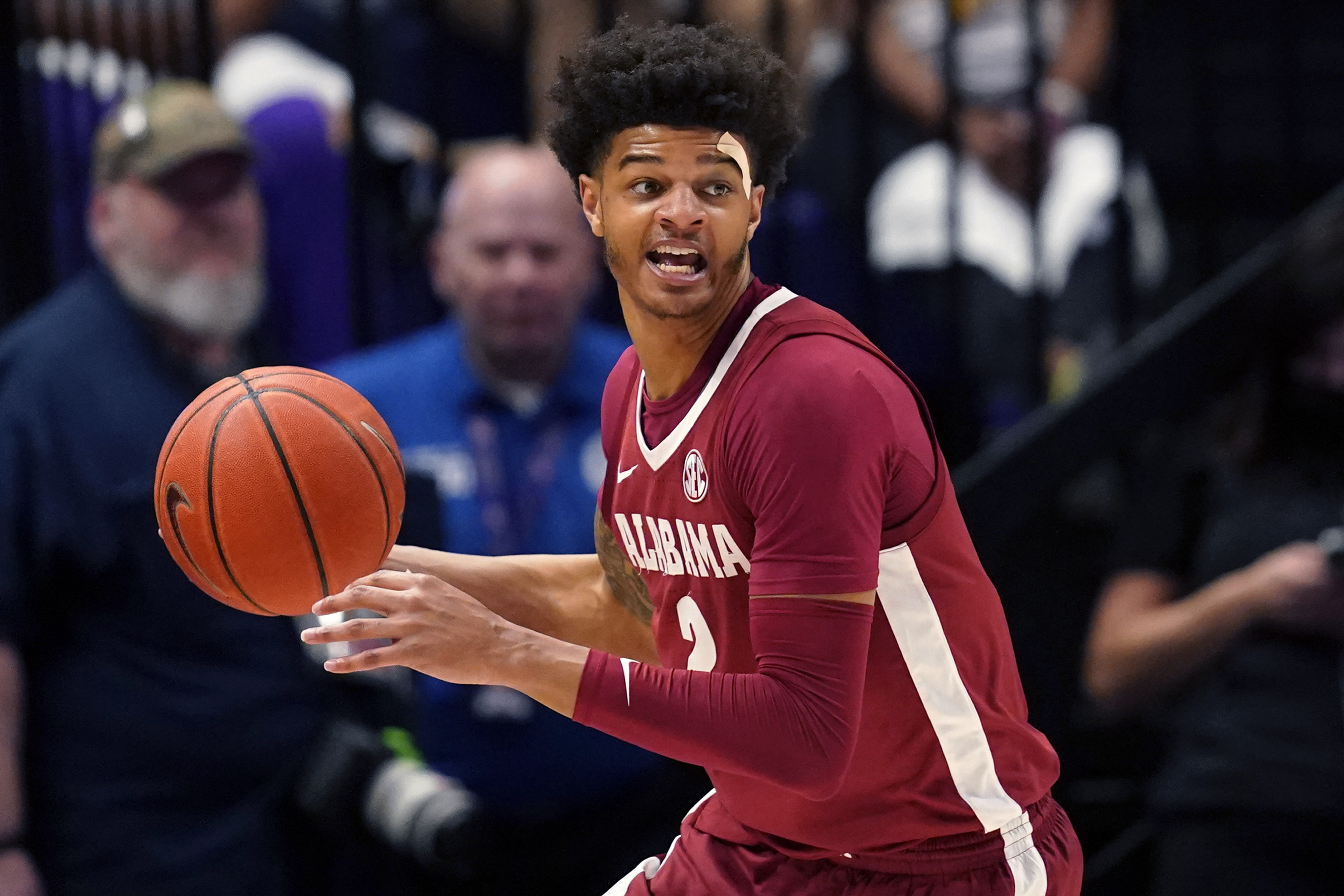 FILE - Alabama forward Darius Miles looks to pass in the second half an NCAA college basketball game against LSU in Baton Rouge, La., March 5, 2022. The former University of Alabama basketball player has pleaded not guilty Monday, April 3, 2023, to a capital murder charge filed against him after he was accused of providing the gun used in a fatal shooting near campus.
