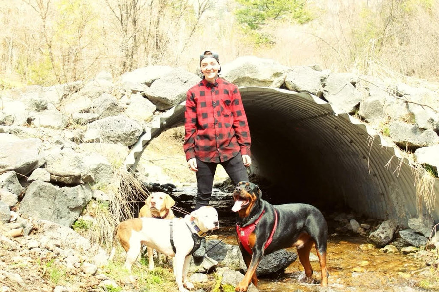 Kortnie Balls stands with her dogs. Balls is being honored with an award for attempting to save a man from a burning building one year ago.