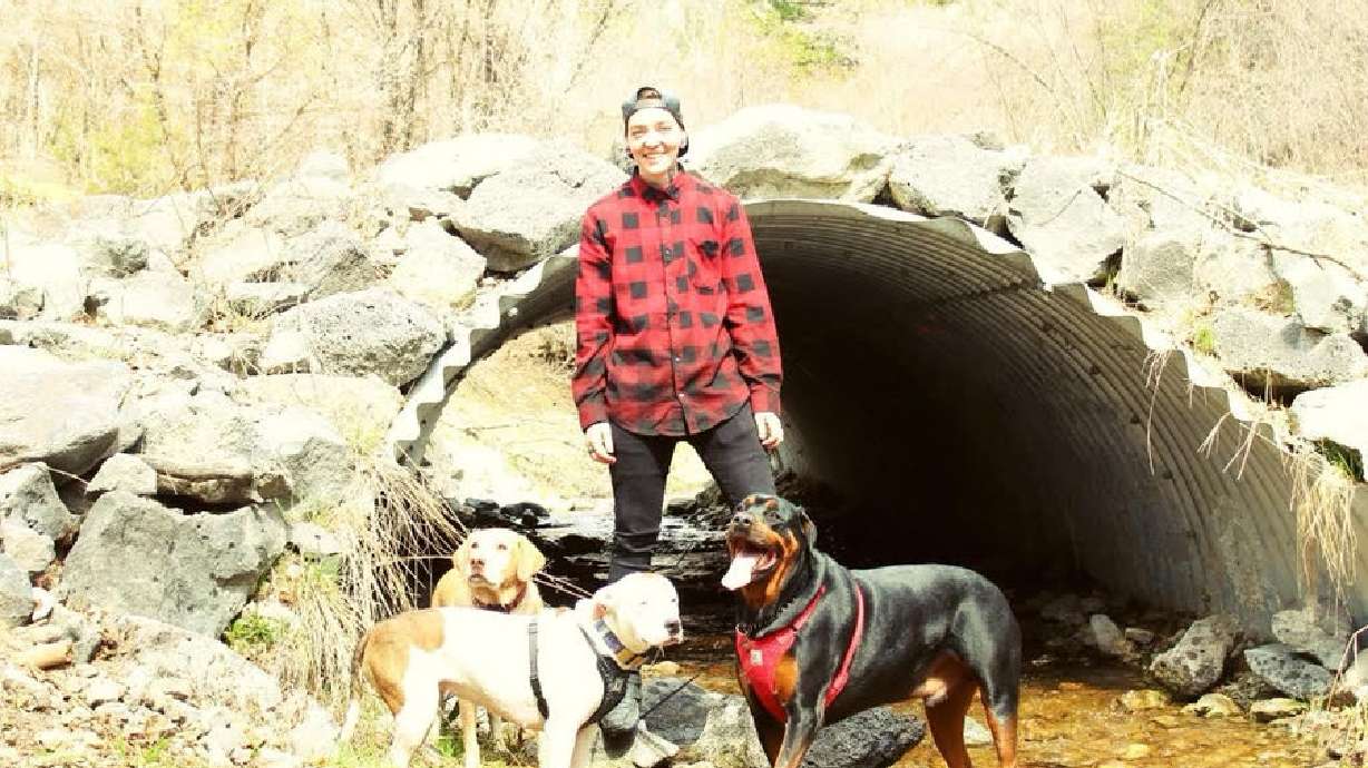 Kortnie Balls stands with her dogs. Balls is being honored with an award for attempting to save a man from a burning building one year ago.