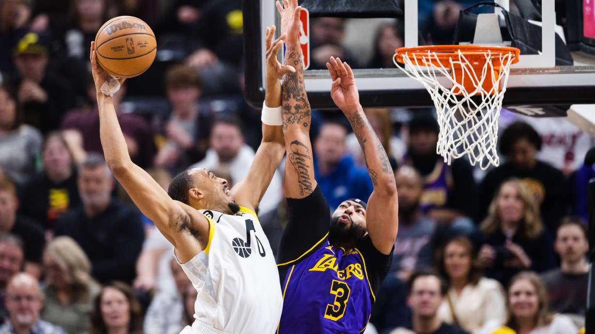 Utah Jazz guard Talen Horton-Tucker (0) attempts a dunk against Los Angeles Lakers forward Anthony Davis (3) during an NBA basketball game between the Utah Jazz and Los Angeles Lakers at Vivint Arena in Salt Lake City on April 4, 2023.