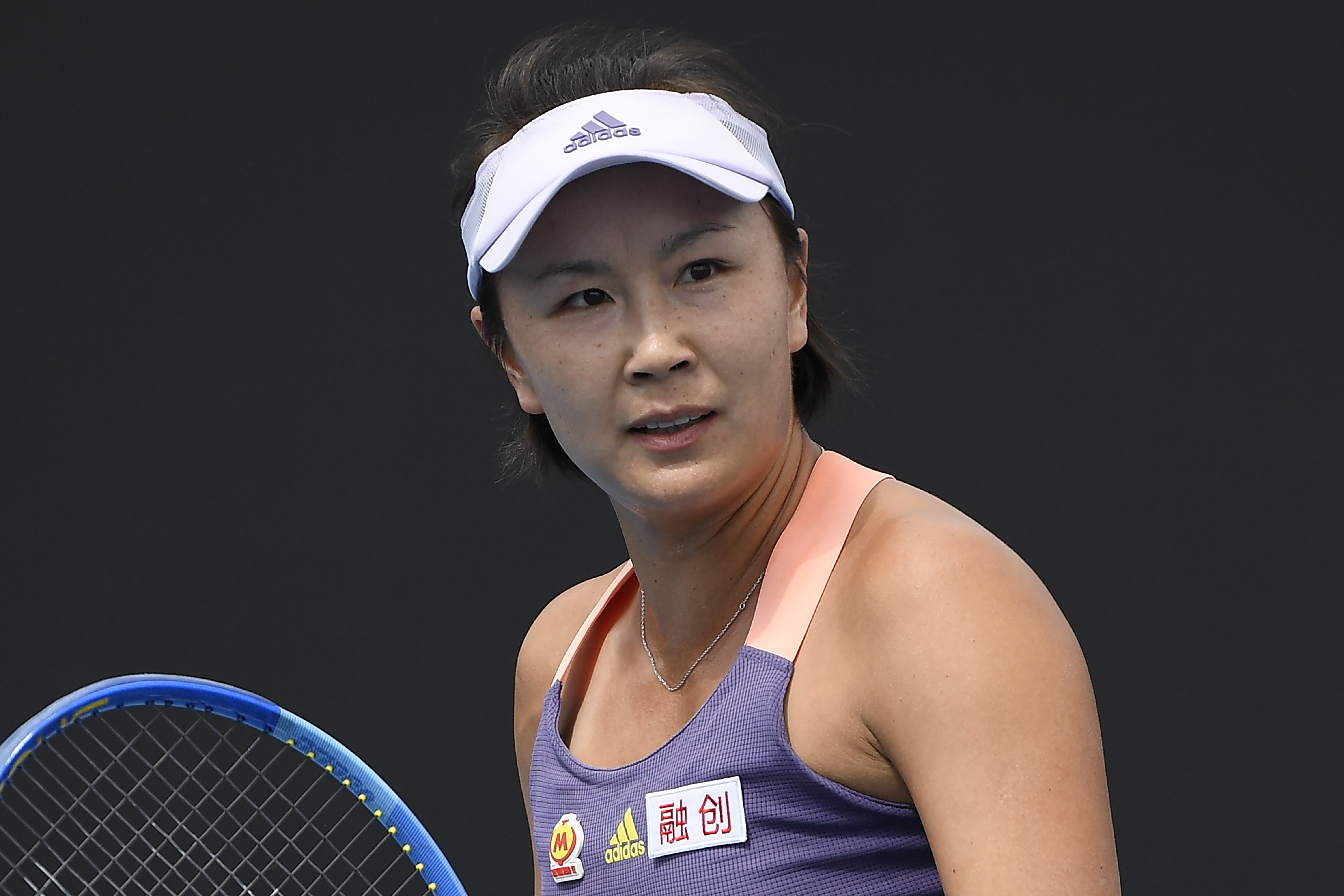 FILE - China's Peng Shuai reacts during her first round singles match against Japan's Nao Hibino at the Australian Open tennis championship in Melbourne, Australia on Jan. 21, 2020. The International Tennis Federation will play tournaments in 2023 in China despite no known resolution to the case of Chinese doubles player Peng. Peng disappeared from pubic view shortly after accusing a former high-ranking Communist Party official — in a web posting in November of 2021 — of sexual assault. 
