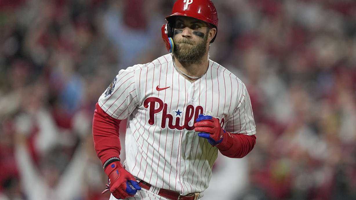 FILE - Philadelphia Phillies' Bryce Harper runs the bases after a two-run home run during the first inning in Game 3 of baseball's World Series between the Houston Astros and the Philadelphia Phillies on Nov. 1, 2022, in Philadelphia. Harper was placed on the 10-day injured list Thursday, March 30, 2023 by the Phillies, who avoided the 60-day list for their star slugger and left open the opportunity that he could return before the end of May.