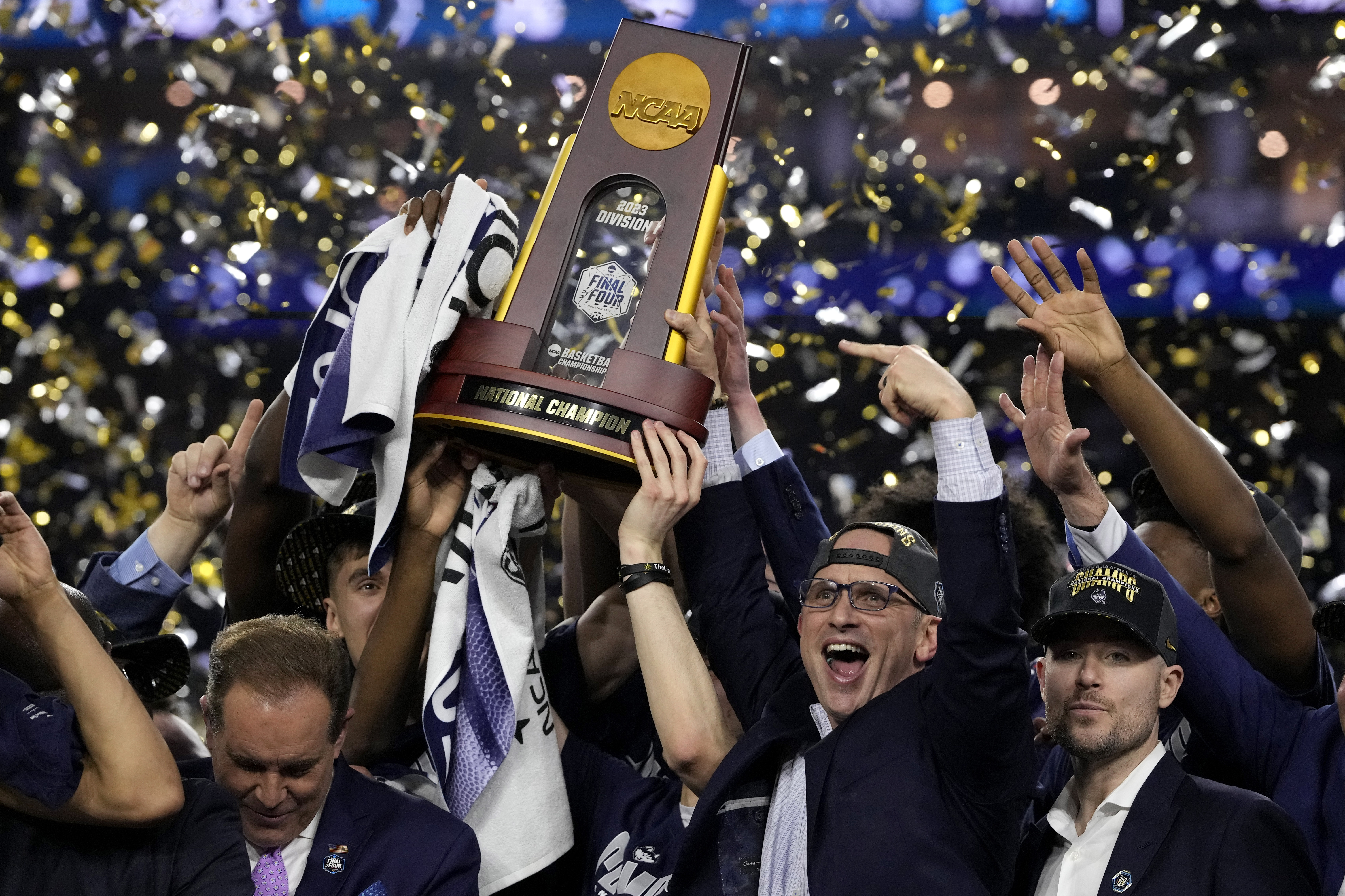 Connecticut head coach Dan Hurley celebrates with the trophy after their win against San Diego State in the men's national championship college basketball game in the NCAA Tournament on Monday, April 3, 2023, in Houston. 