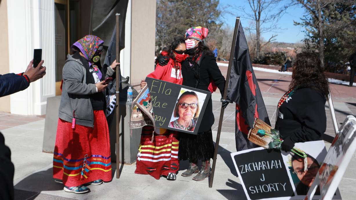 Seraphine Warren, center left, is embraced by state Sen. Shannon Pinto outside the state capitol building on Feb. 4, 2022, in Santa Fe, N.M. A federal grand jury has indicted a New Mexico man on assault and carjacking charges in connection with the 2021 disappearance of Ella Mae Begay.