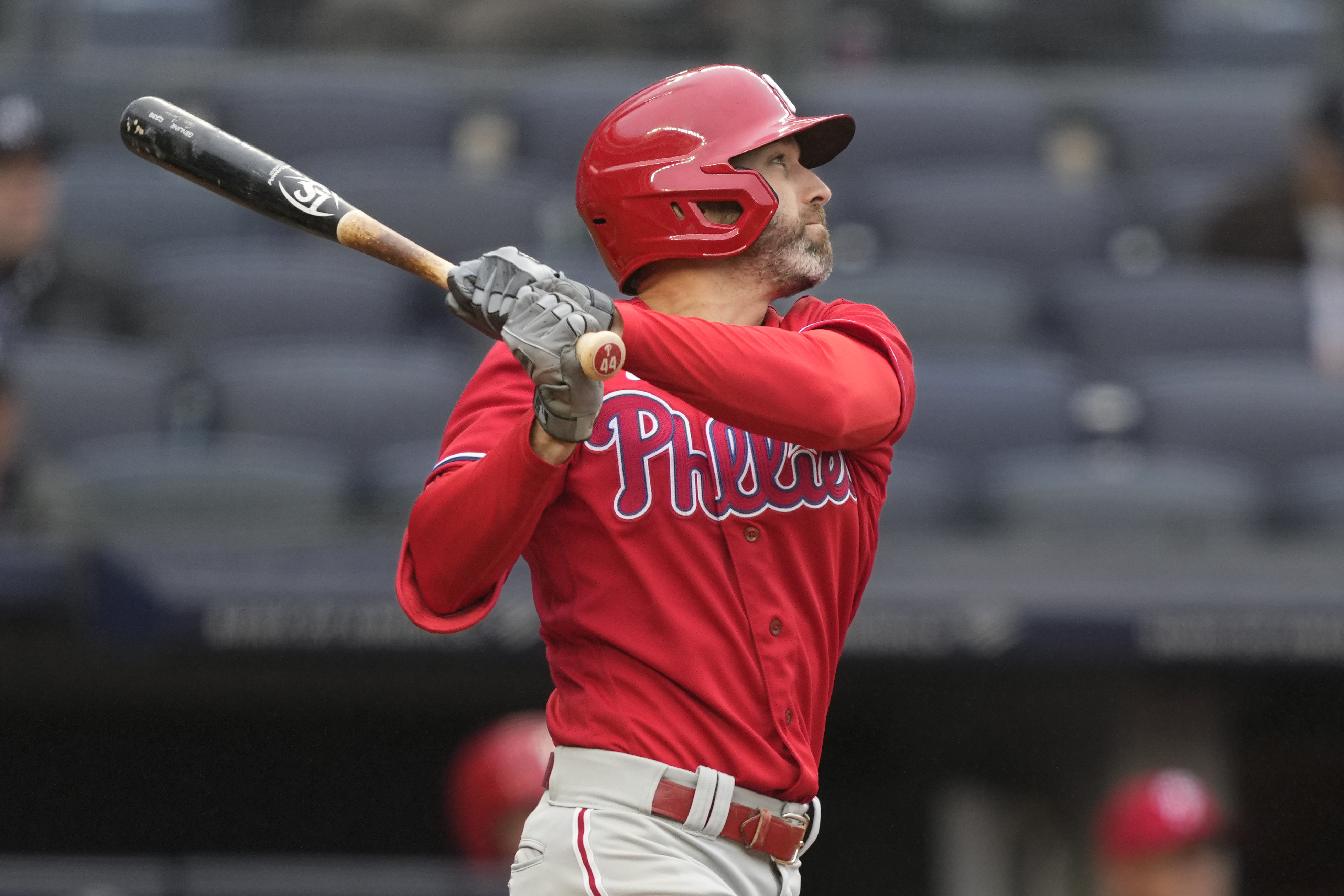 Philadelphia Phillies' Jake Cave hits an RBI sacrifice fly off New York Yankees relief pitcher Jonathan Loaisiga in the seventh inning of a baseball game, Wednesday, April 5, 2023, in New York.