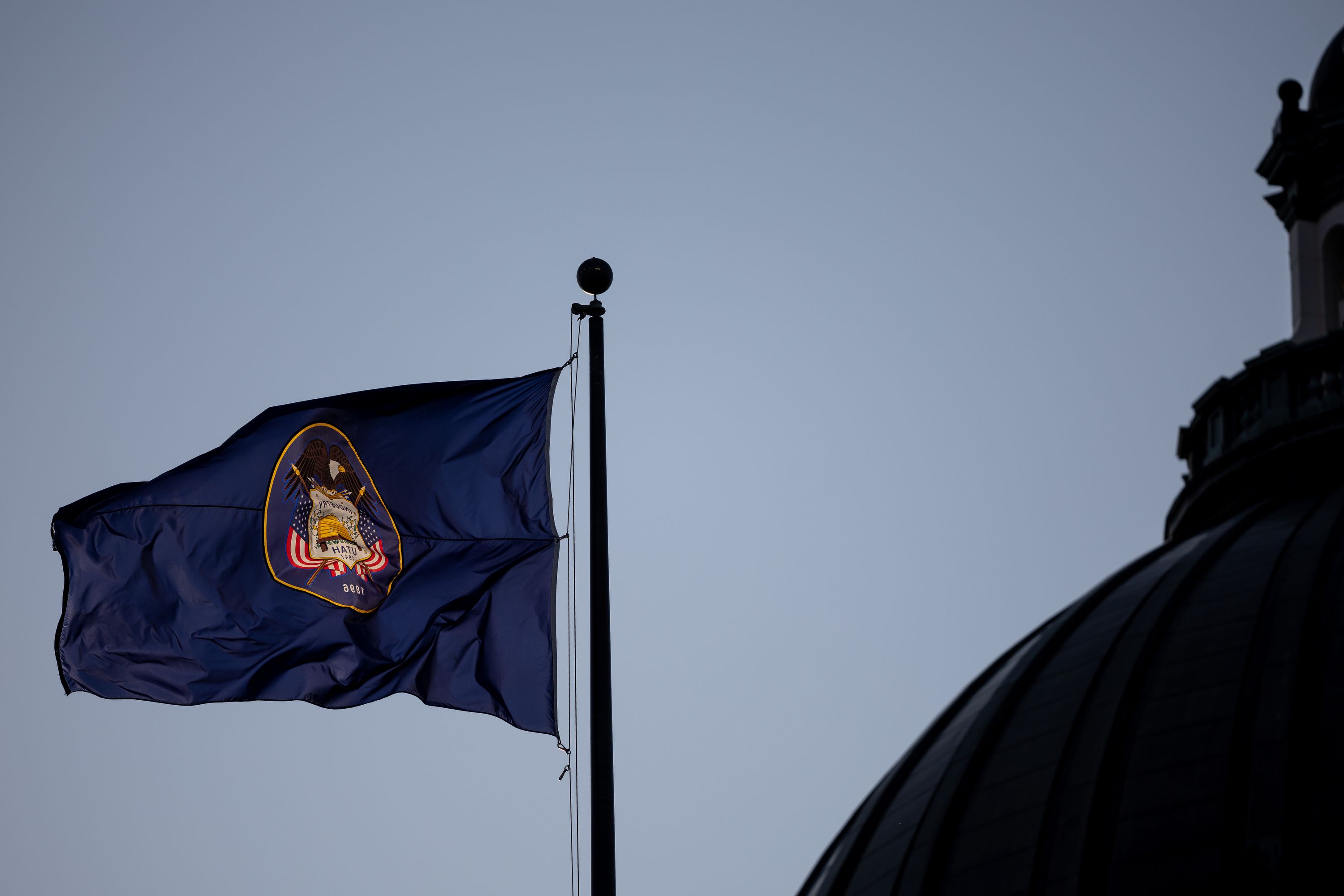 The state flag flutters outside the Capitol in Salt Lake City on the last night of the legislative session March 3.