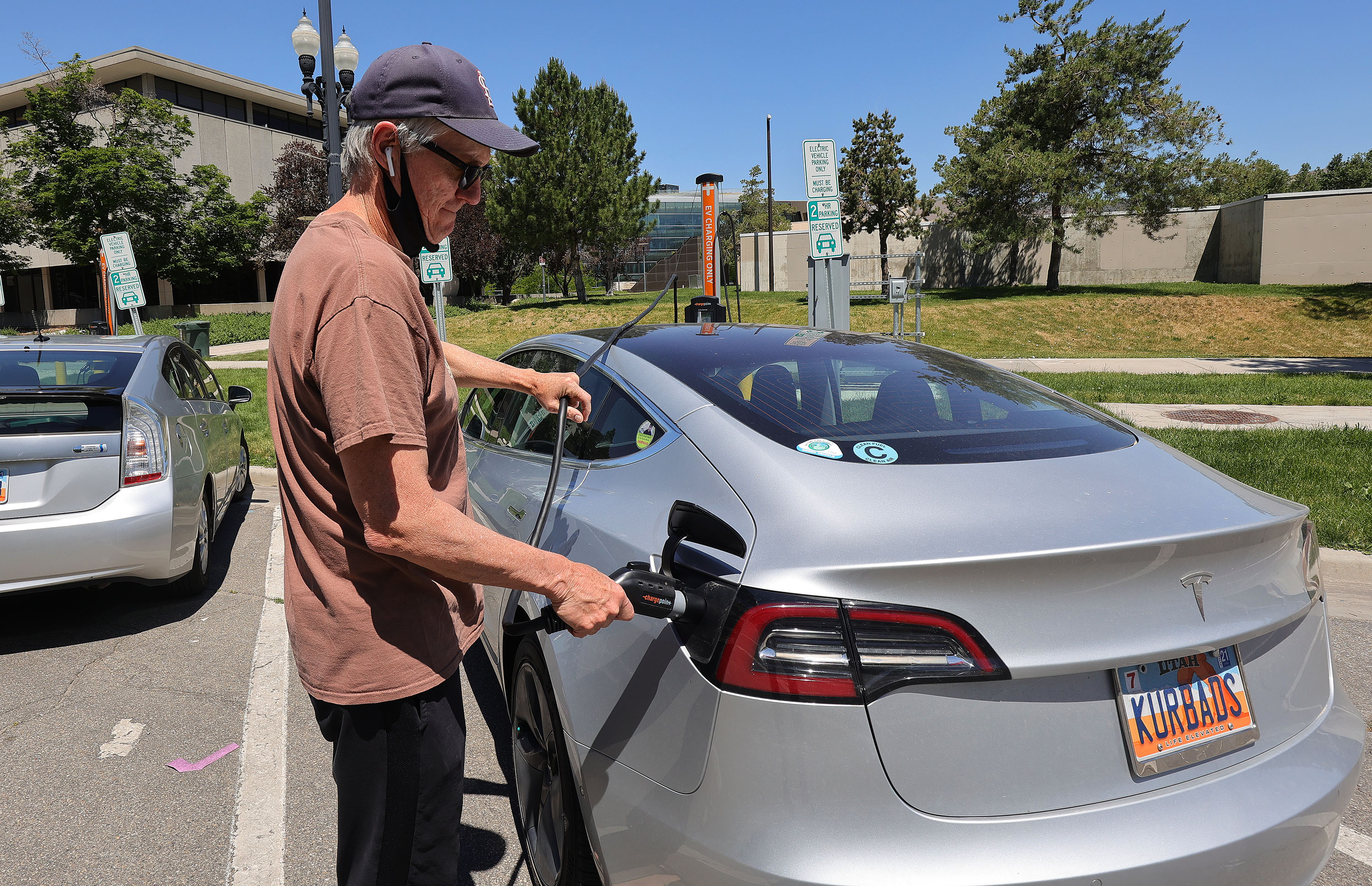 David Mack charges his electric vehicle in Salt Lake City on June 4, 2021. The number of electric vehicles registered in Utah has increased by more than 200% from 2020 to 2023. 