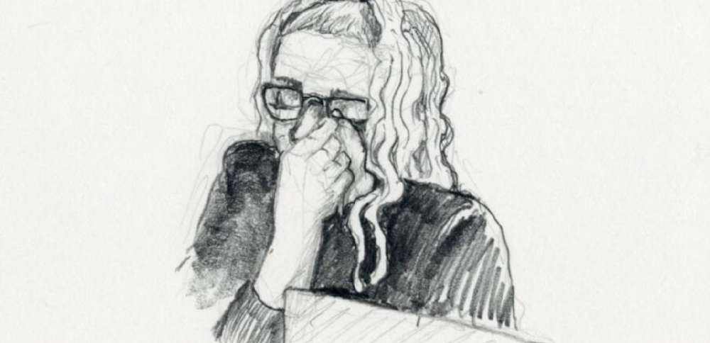 Lori Vallow Daybell appears to wipe her eyes or wipe her glasses during jury selection Wednesday in Boise, Idaho. 