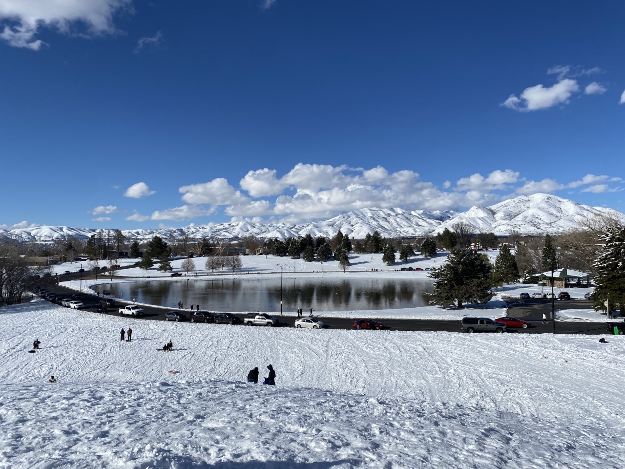 Attitudes about the constant snowfall was joyful for an afternoon at Sugar House Park on Wednesday, where dozens converged on a large hill to take advantage of a spring day of sledding.