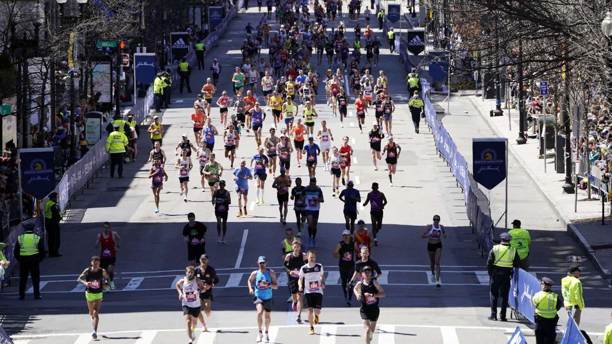 FILE - Runners approach the finish line of the Boston Marathon, Monday, April 18, 2022, in Boston. Massachusetts gambling regulators on Thursday, April 6, 2023, denied a request to allow legal betting on this year's Boston Marathon, citing opposition by the race's organizers as one reason. The state last month started allowing online sports wagering on pro sports and some college sports.