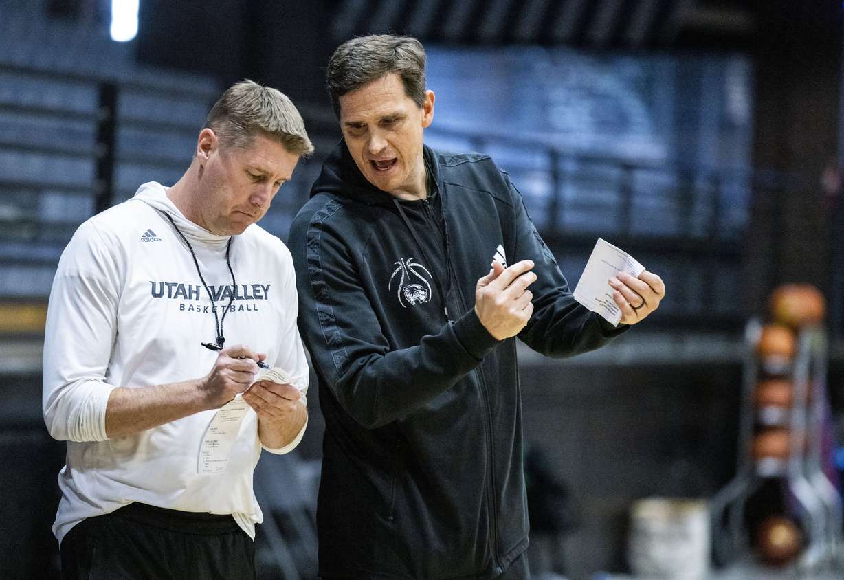 Utah Valley University Wolverine men’s basketball coaches Mark Madsen and Todd Phillips, left, prepare for the Western Athletic Conference Tournament in Las Vegas, Nevada on Wednesday, March 8, 2023.