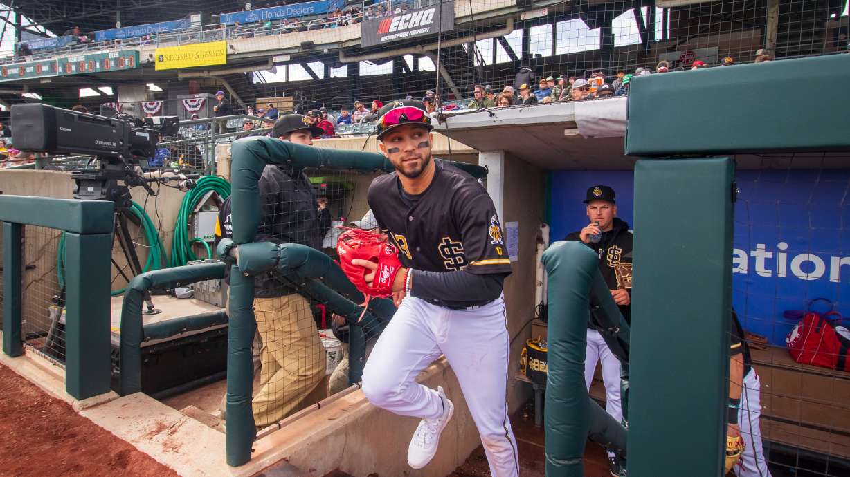 Salt Lake Bees infielder Livan Soto runs out onto the field before the first pitch of a game against the Sacramento River Cats on March 31. Triple-A players received a major salary boost this year after a new collective bargaining agreement.