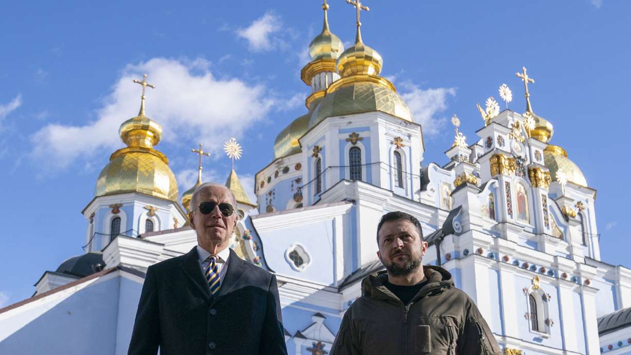 President Joe Biden walks with Ukrainian President Volodymyr Zelenskyy at St. Michael’s Golden-Domed Cathedral on Feb. 20, in Kyiv.