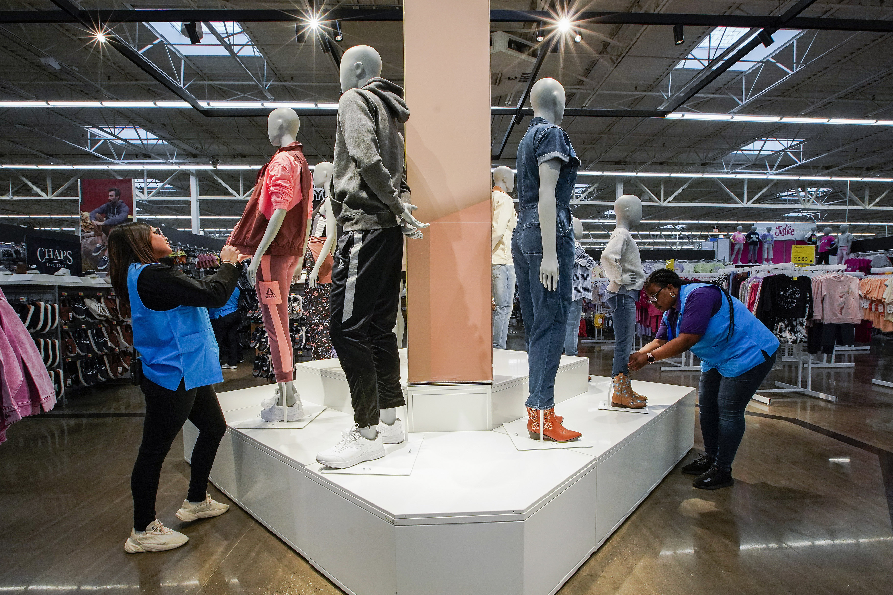 Workers organize mannequins inside the Walmart Supercenter in North Bergen, N.J. on Feb. 9. On Friday, the U.S. government issues the March jobs report.