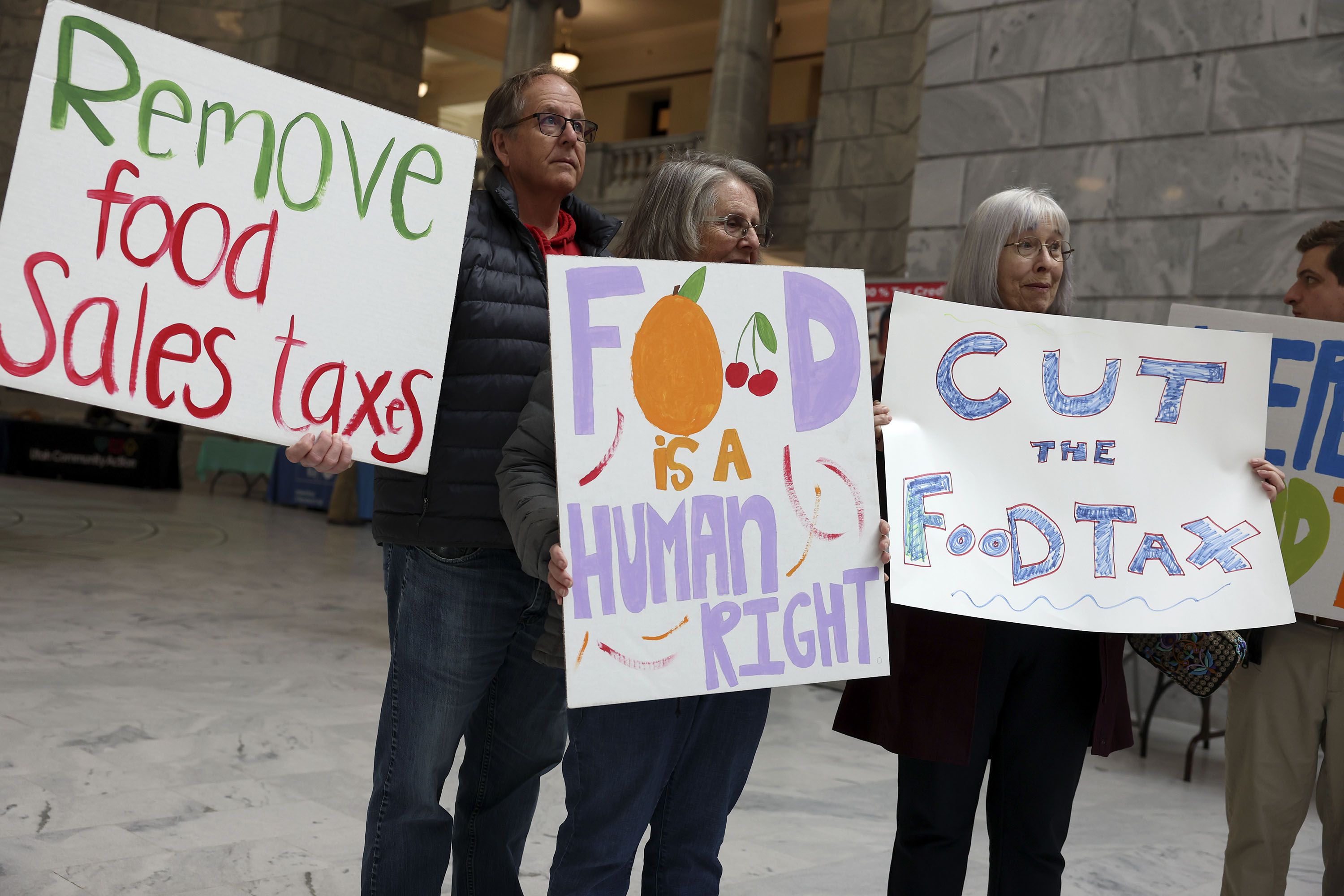 “More Bread for Utahns!” members Bill Hooper, Sharon Roper and Margo Markowski rally to repeal Utah’s grocery sales tax at the Capitol in Salt Lake City on Thursday, Feb. 9, 2023.