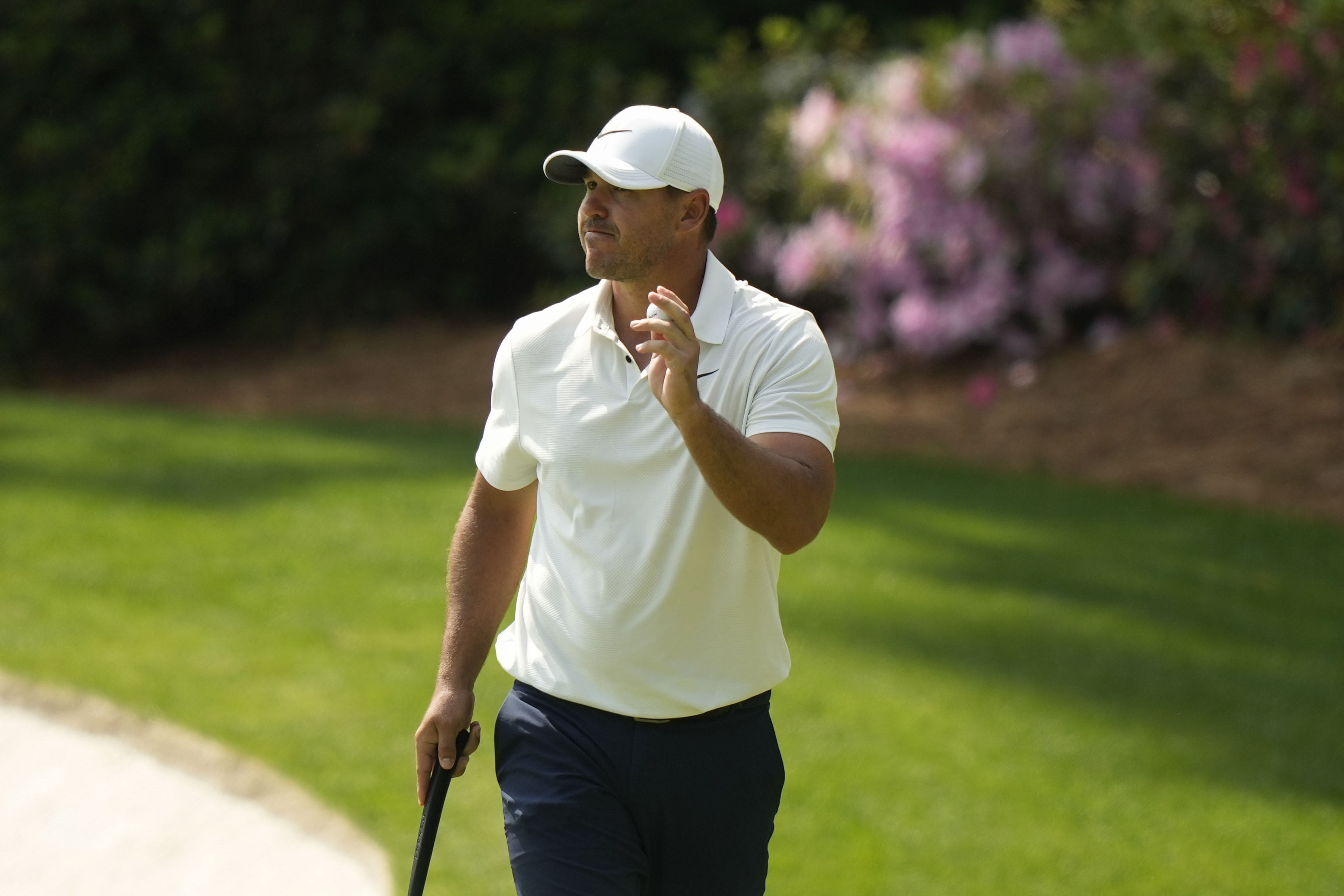 Brooks Koepka waves after his putt on the 13th hole during the second round of the Masters golf tournament at Augusta National Golf Club on Friday, April 7, 2023, in Augusta, Ga. 