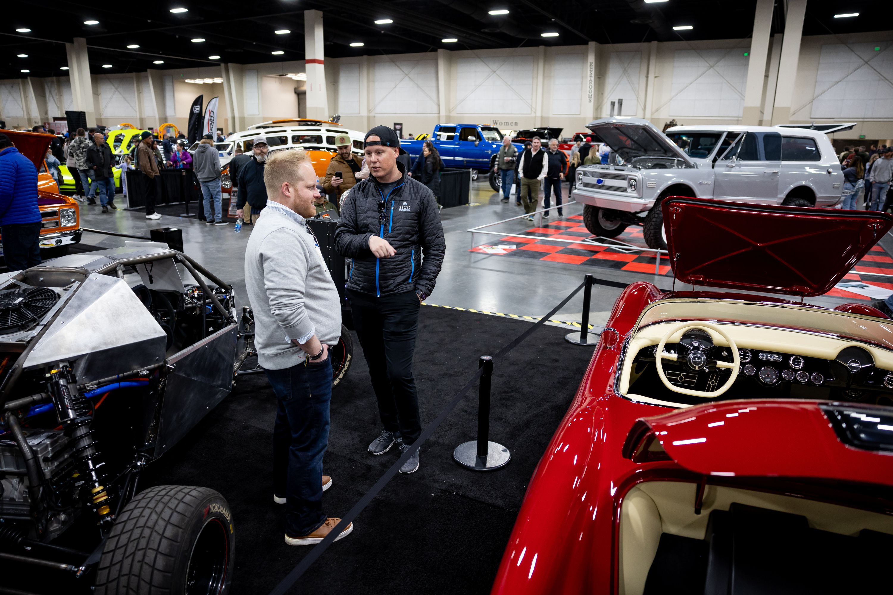 Hypercraft CEO and cofounder Jake Hawksworth talks to an attendee at the company’s booth at the AutoRama car show at the Mountain America Expo Center in Sandy on Saturday, March 4.