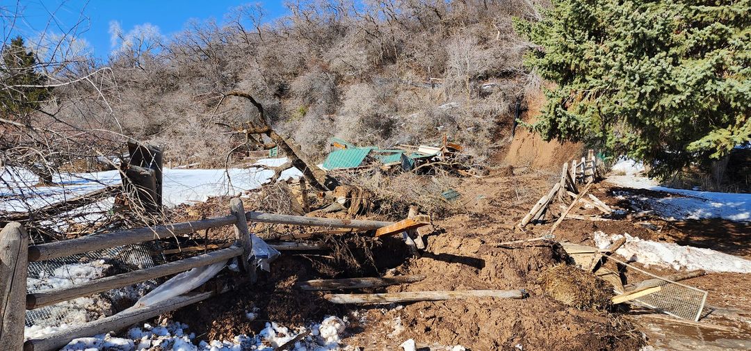 A mudslide in Fruit Heights swept away a large shed and trapped a man and a woman Saturday, sending one of them to a hospital.